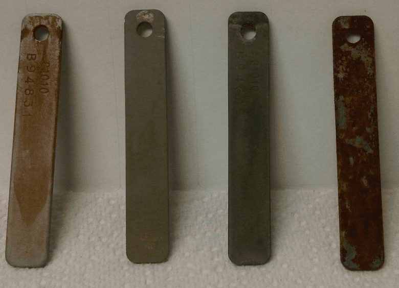 Metal corrosion coupons after immersion testing — protected by SCL 8054.